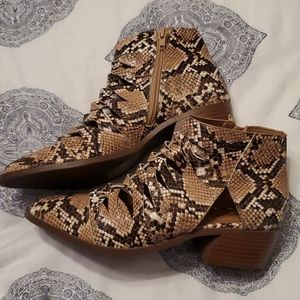 Perforated snake skin boots
